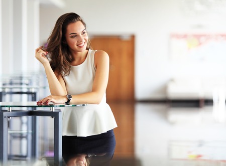 Modern business woman in the office with copy spaceの写真素材
