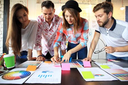 Group of young business people and designers.They working on new project.Startup concept