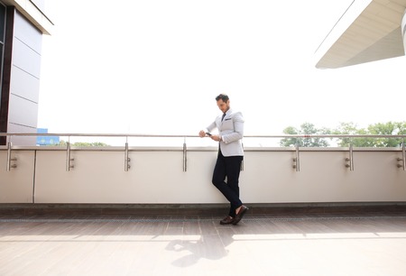 Portrait of an handsome businessman in an urban setting.の写真素材