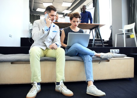 Startup Diversity Teamwork Brainstorming Meeting Concept.Business Team Coworkers Analyze Finance Report Laptop.People Working Start Up Process.Group Young Hipsters Discussing Officeの写真素材