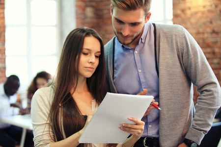 Startup Diversity Teamwork Brainstorming Meeting Concept.Business Team Coworkers Sharing World Economy Report Document Laptop.People Working Planning Start Up.Group Young Hipsters Discussing Cafe.の写真素材