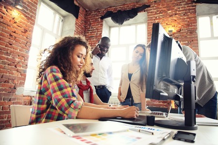 Startup Diversity Teamwork Brainstorming Meeting Concept.Business Team Coworkers Sharing World Economy Report Document Laptop.People Working Planning Start Up.Group Young Hipsters Discussing Cafe.の写真素材