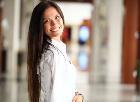 Smiling confident business woman looking at cameraの写真素材