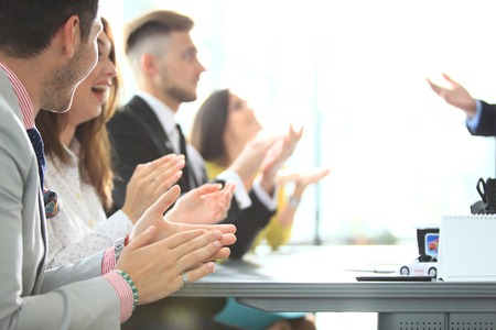 Photo of partners clapping hands after business seminar. Professional education, work meeting, presentation or coaching conceptの写真素材