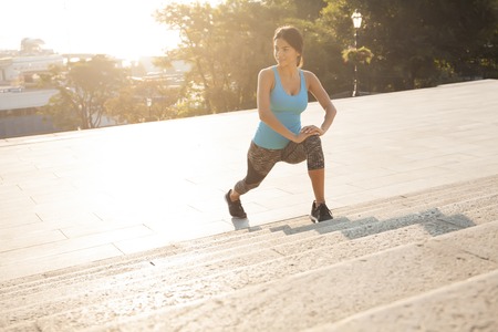 fitness and lifestyle concept - woman doing sports outdoors.