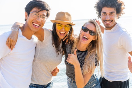 Portrait Of Friends Having Fun Together On Beach Vacation.