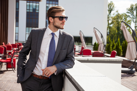Portrait of an handsome businessman in an urban setting.の写真素材