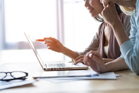 Two female colleagues in office working together.の写真素材
