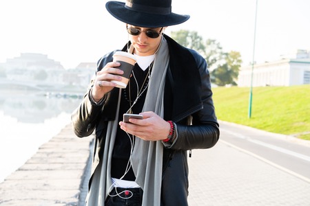 Fashion outdoor photo of stylish handsome man with sunglasses