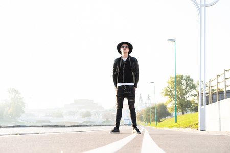 Fashion outdoor photo of stylish handsome man with sunglassesの写真素材