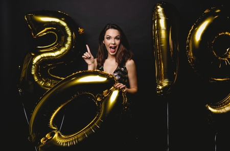 New Year. Woman With Balloons Celebrating At Party. Portrait Of Beautiful Smiling Girl In Shiny...