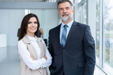Photo of two colleagues discussing about the project in the office.の写真素材