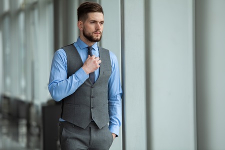 Portrait of a businessman looking at the windowの写真素材