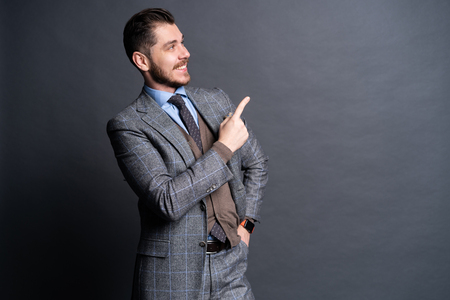 Smiling happy man making presentation of new product.の写真素材