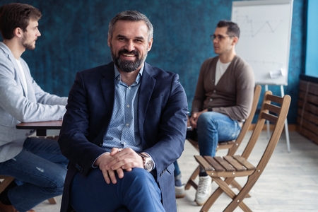 Portrait Of Mature Businessman Working In Office.の写真素材