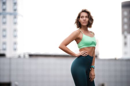 Beautiful fitness girl in sportswear resting after workout session. Concept of sport, wellness and...