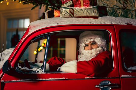 Portrait of Santa Claus. Santa Claus is driving a carの写真素材