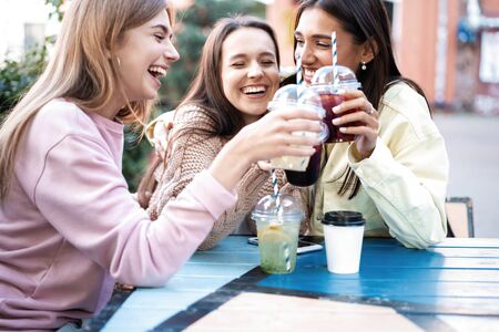 Group Of Friends Drinking Cocktails At Outdoor Barの写真素材