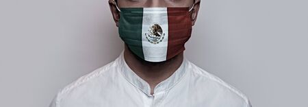 Corona virus pandemic. Concept of Corona virus quarantine, Covid-19. The male face is covered with a medical maskの写真素材