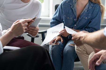 Young business professionals having a meeting. Diverse group of young designers smiling during a...