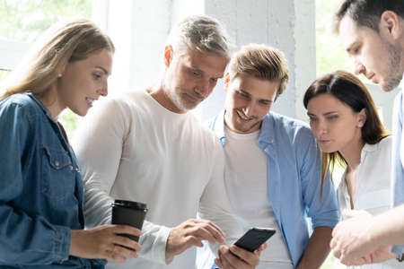 Team of colleagues brainstorming together while working in office.