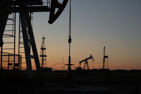 Oil Pump on orange sunset.の写真素材