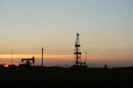 Oil Pump on orange sunset.の写真素材