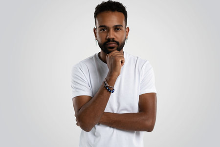 Handsome young african american guy posing in studio - isolated.の写真素材