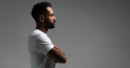 Handsome young african american guy posing in studio - isolated.の写真素材