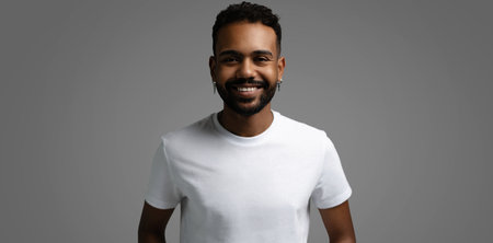 Handsome young african american guy posing in studio - isolated.の写真素材
