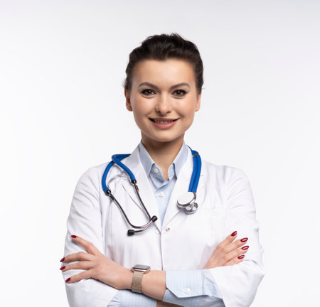 Portrait of pretty positive lady doctor with empty space blank isolated on white backgroundの写真素材