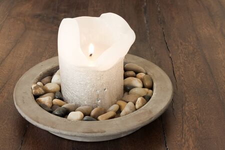 Warm Candle in Stones Settingの写真素材