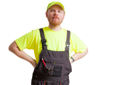 Construction Worker with Coverall and Cap Standing Straightの写真素材
