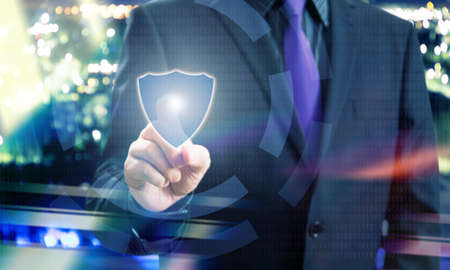 Businessman Pointing Shield Icon of Virtual Touchscreenの写真素材