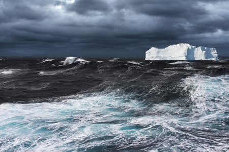 Big Iceberg Drifting in Stormy Oceanの写真素材