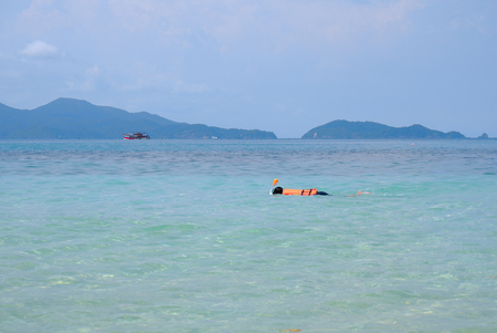 Young woman snorkeling in sea with mask. beautiful sea at Gulf of Thailandのeditorial素材