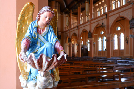Angel statue in The Roman Catholic Maephra Patisonti Niramon Church, This is iconic of built French style at Chanthaburi Province, Thailand.の写真素材