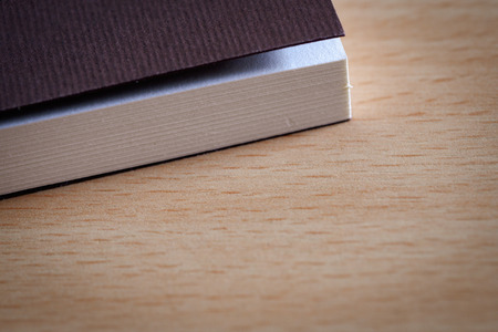 Book diary to give souvenirs placed on wooden table.