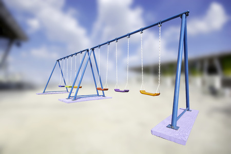 A swing Children colorful playground  isolated on cloud backgroundの写真素材