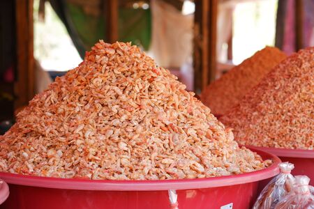 Dried shrimp in a large basin red, sold in rural markets.の写真素材