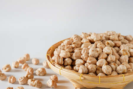 Close-up chickpeas in a wooden basket is a healthy nut that is perfect for vegetarians or those who...