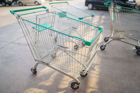 shopping carts with wheels for shopping malls land on the floor in the parking lot of customers.の写真素材