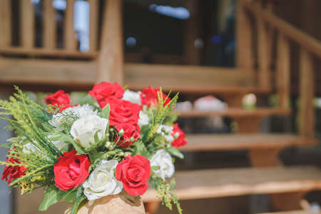 Red bouquets decorate the stairs of the house for a celebration, Welcome at the wedding.の写真素材