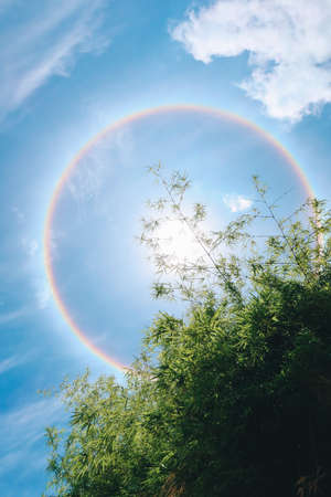 Sun halo is a natural phenomenon that looks like a reflection of many suns overlapping larger than usual. There was a rainbow aura surrounding it. The one in the middle is the brightest.の写真素材