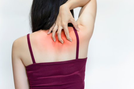 Women have back or shoulder pain from sitting incorrectly, exercising, or having office syndrome.の写真素材