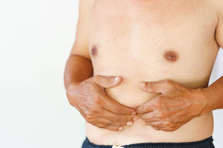 Senior man having stomachache. Abdominal pain in the elderly or intestinal disease.