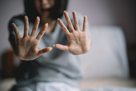 The woman held up her five-fingered hands, intent on telling her not to interfere. Concept of mental...