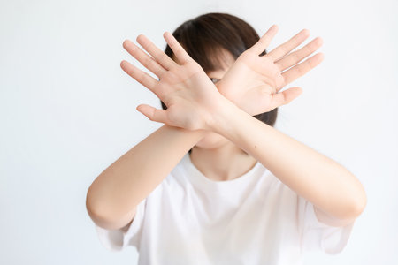 A woman showing a gesture of refusal due to dislike.の写真素材