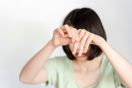 Woman finger joint pain due to arthritis. Concept of health problems.の写真素材
