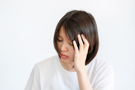 Asian woman stress headache.Concept of health problems.の写真素材